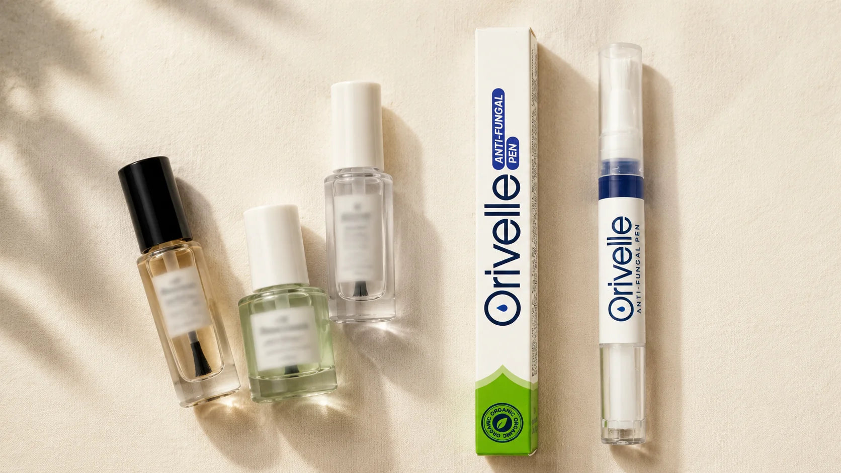 Editorial flat-lay hero showing nail polish bottles with brush applicators on the left, and the Orivelle anti-fungal pen with its green-and-white box on the right, on a warm cream linen surface, soft natural daylight.