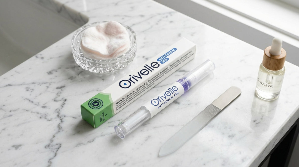 Orivelle pen on a bathroom counter next to nail care products