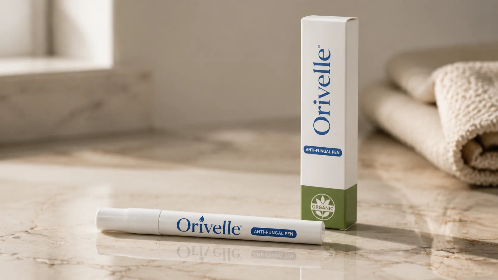 Clean product shot of the Orivelle pen on a marble surface, daylight, no marketing graphics