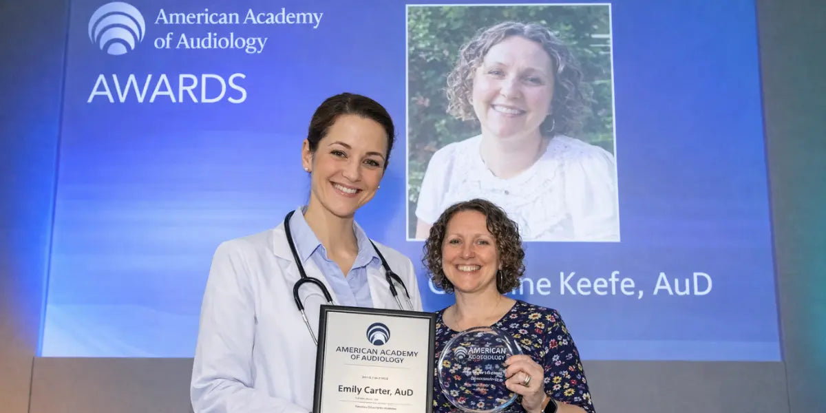 Accepting an American Academy of Audiology award. Two decades treating the people other clinics gave up on.